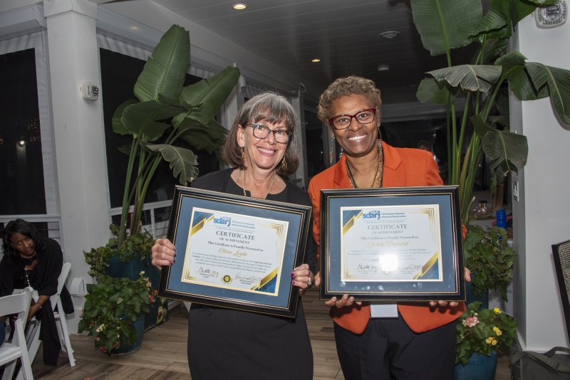 Volunteer chairs Clara Licata and Sandy Baynard are recognized for their contributions to SDARJ.